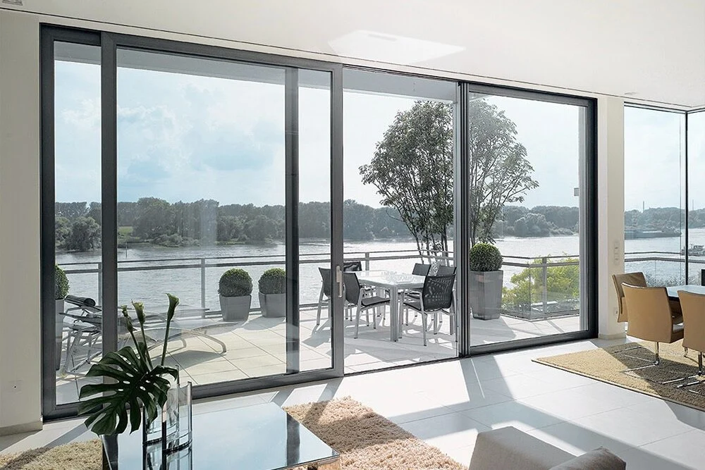 Contemporary living room featuring expansive sliding doors