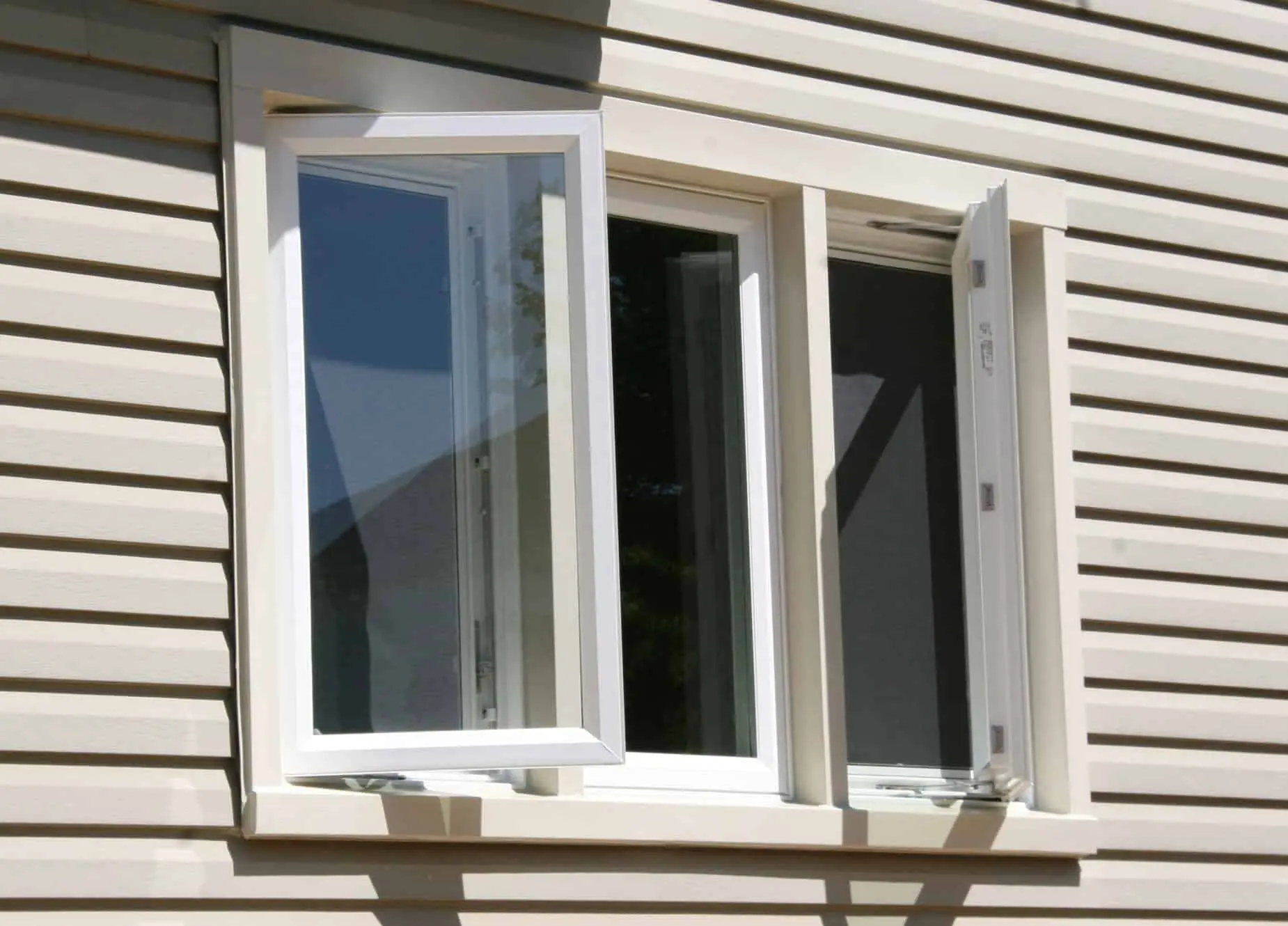 A white framed casement window with a white sash showcasing a clean and modern design