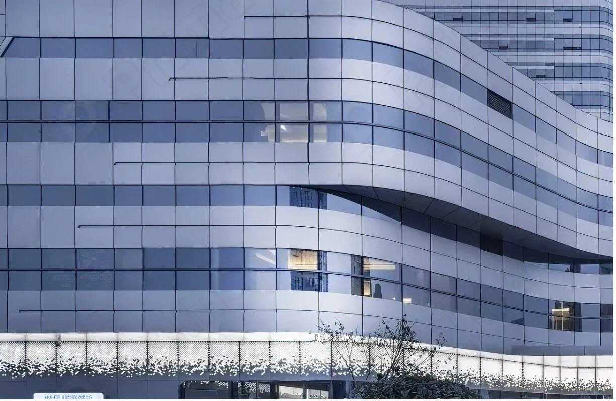 Modern building with sleek curved aluminum and glass facade showcasing innovative design by a top curtain wall supplier