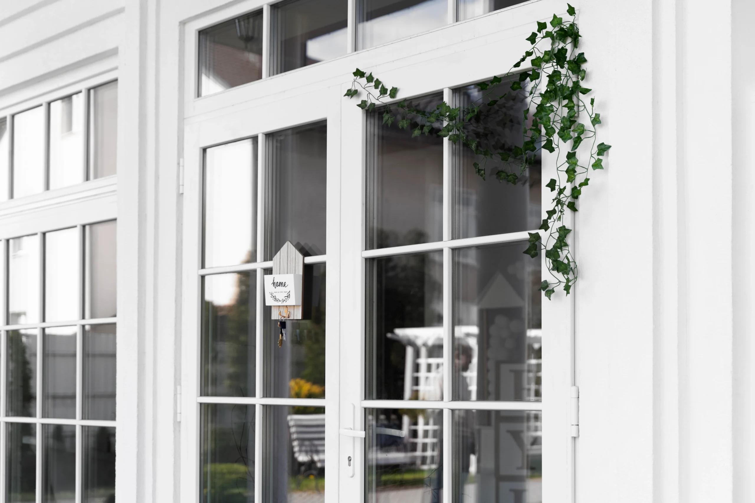 decorated front door with plant