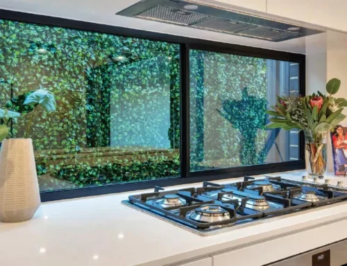 Modern kitchen with gas stovetop and greenery view outside