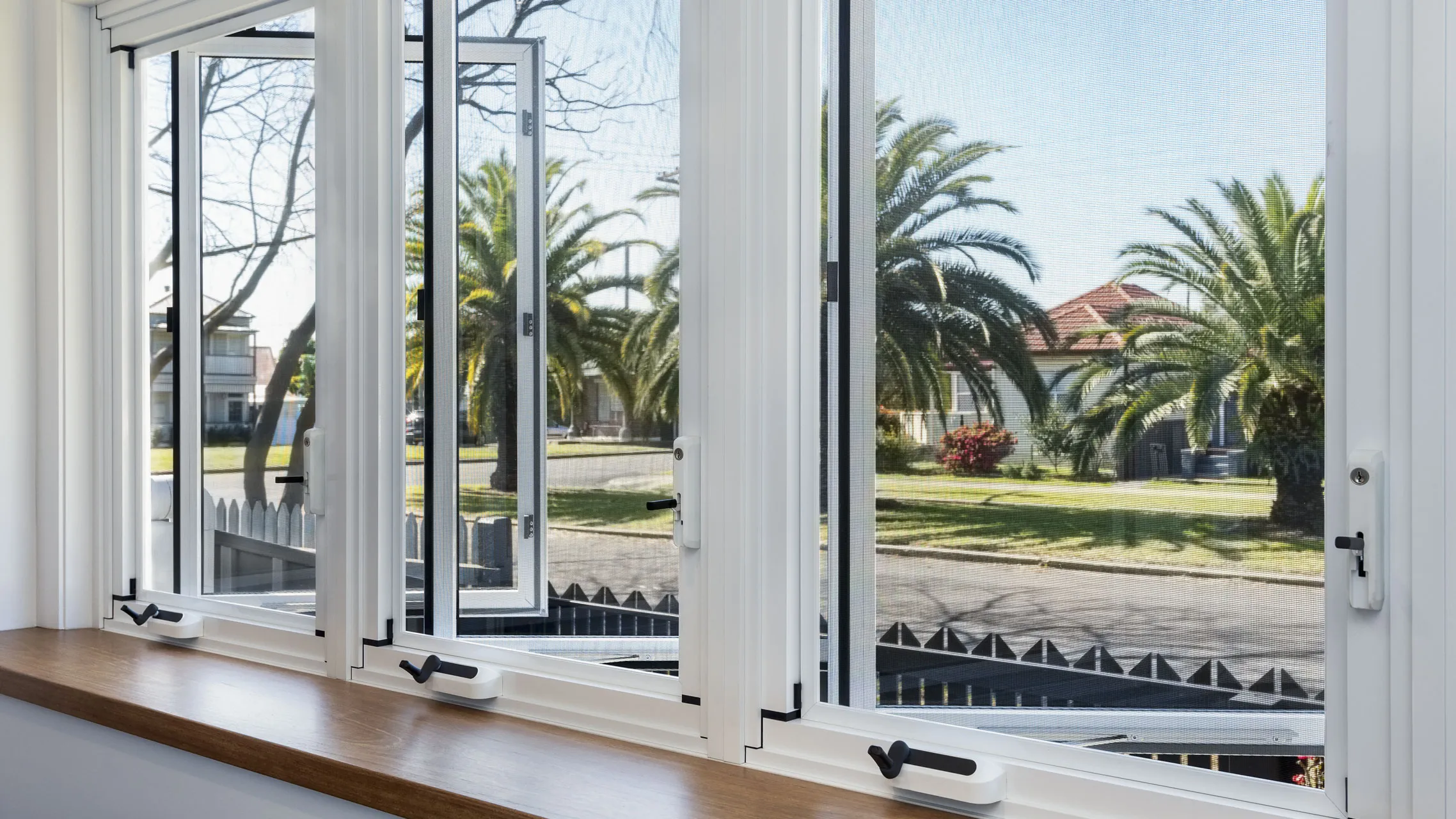 White Casement aluminum Windows above a bench