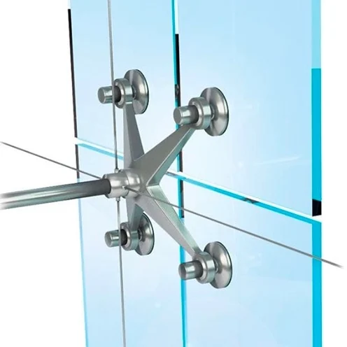 A glass panel featuring four metal bars designed as part of a spider curtain wall structure