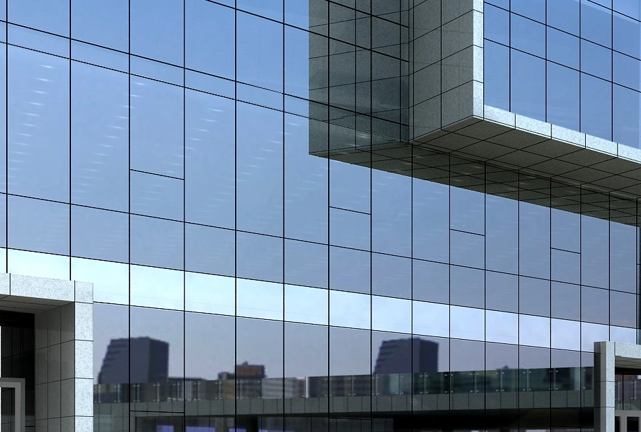 A large building featuring glass walls and a prominent window showcasing an invisible curtain wall design