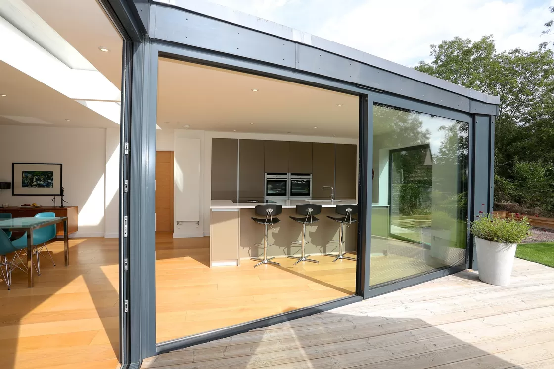 Aluminum sliding glass door offering a view of the coastline