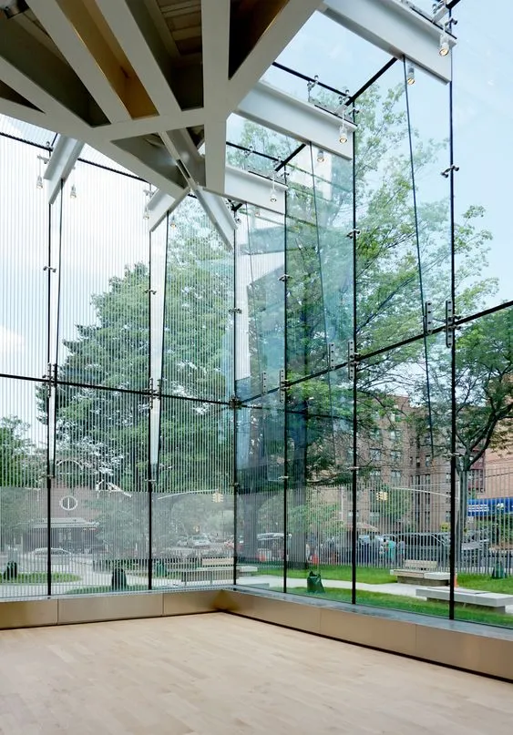 Glass spider curtain wall with floor to ceiling glass panels