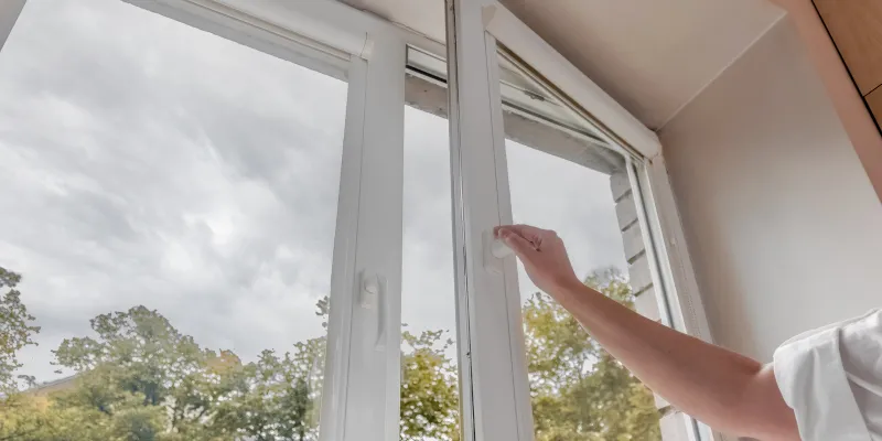 Hand adjusting aluminum window frame for repair and alignment