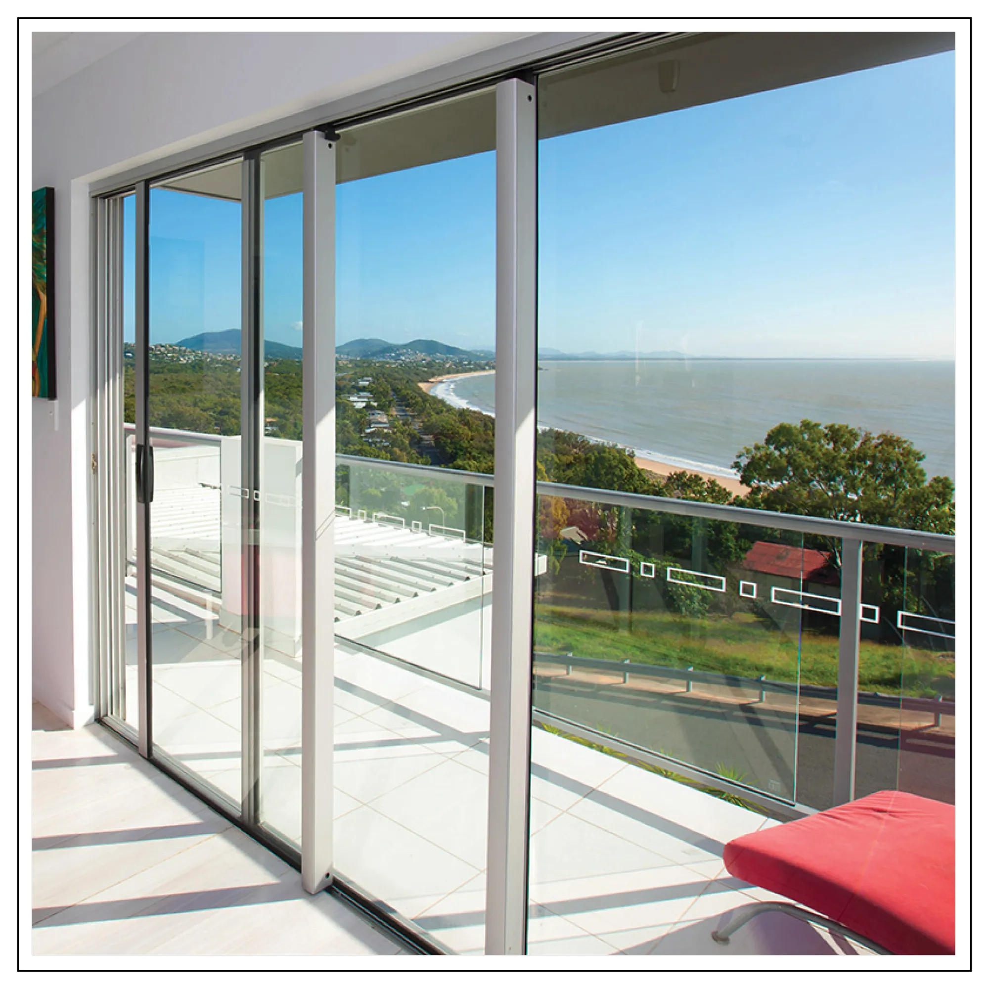 Modern aluminum sliding door opening to a beach view