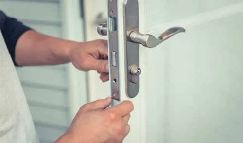 Repairing a faulty lock and handle on a metal door