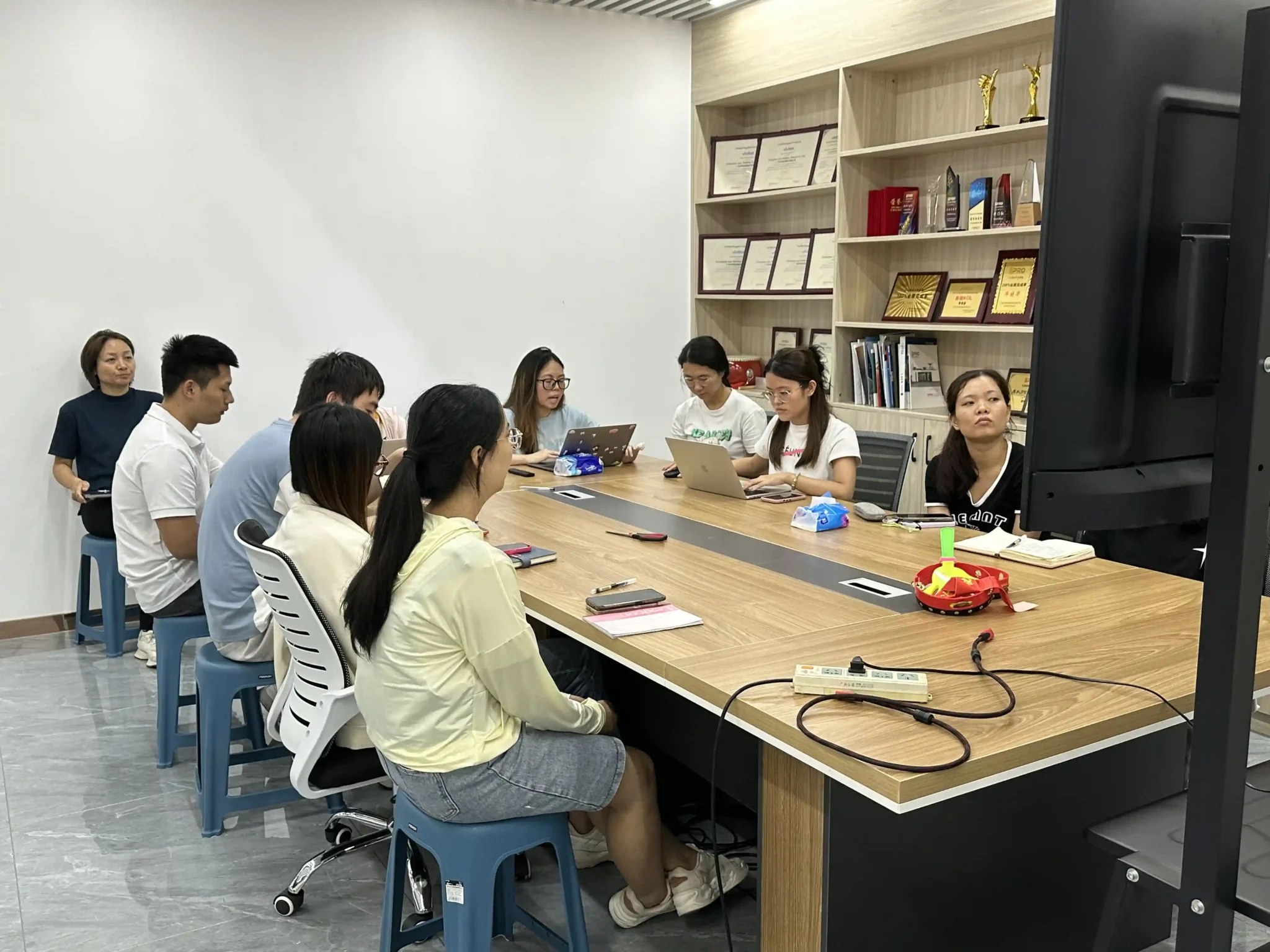 Team of employees attending a training and development meeting