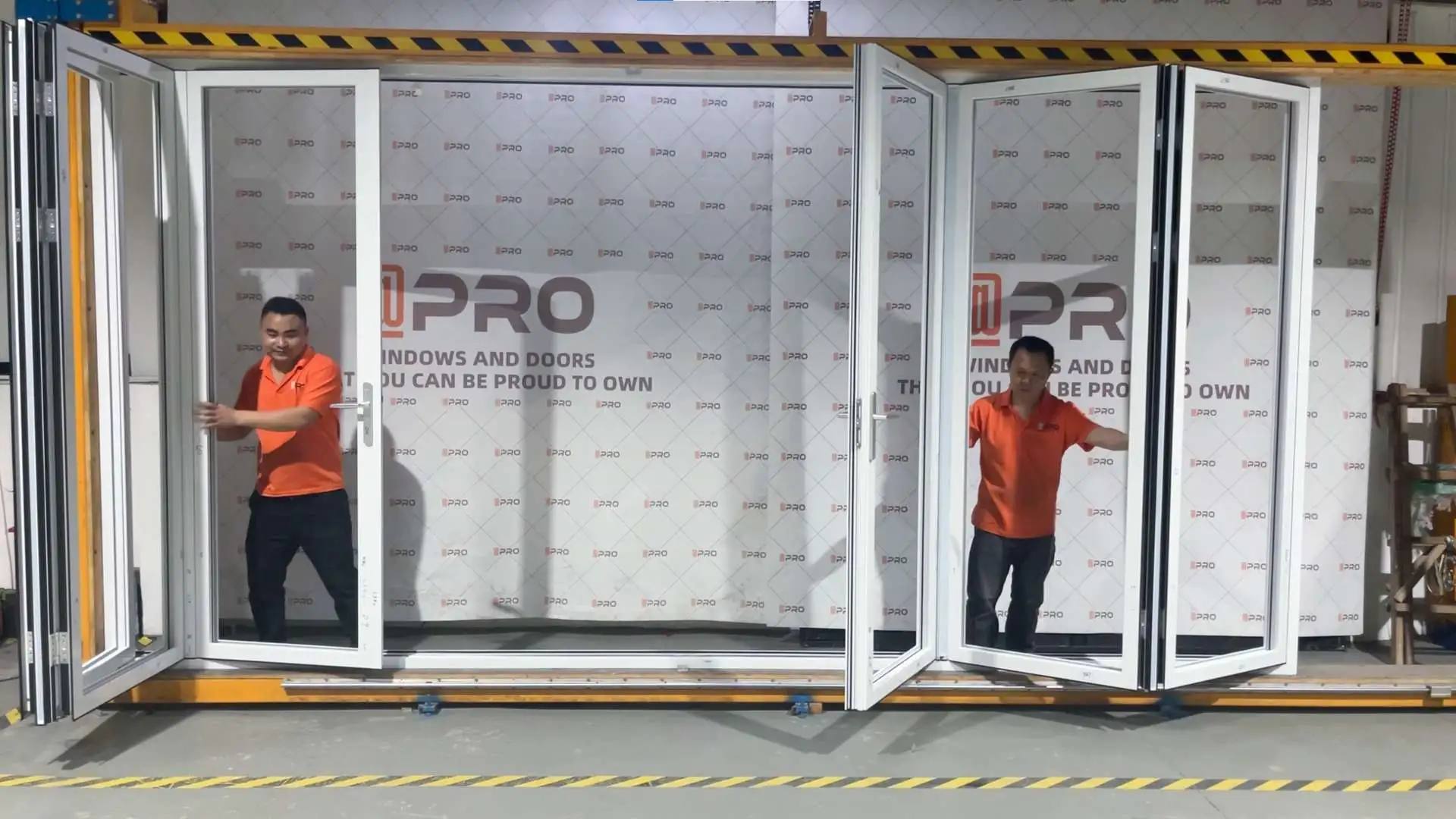 Two workers testing the functionality of sliding doors