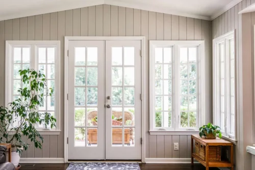 Bright French doors with multiple glass panels in a living area