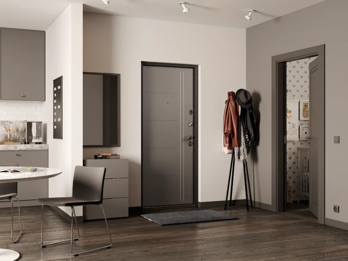 Cozy entryway with a sleek dark gray apartment door