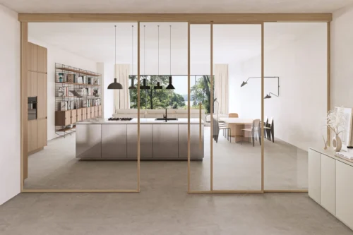 Minimalist kitchen and living space separated by sliding glass doors