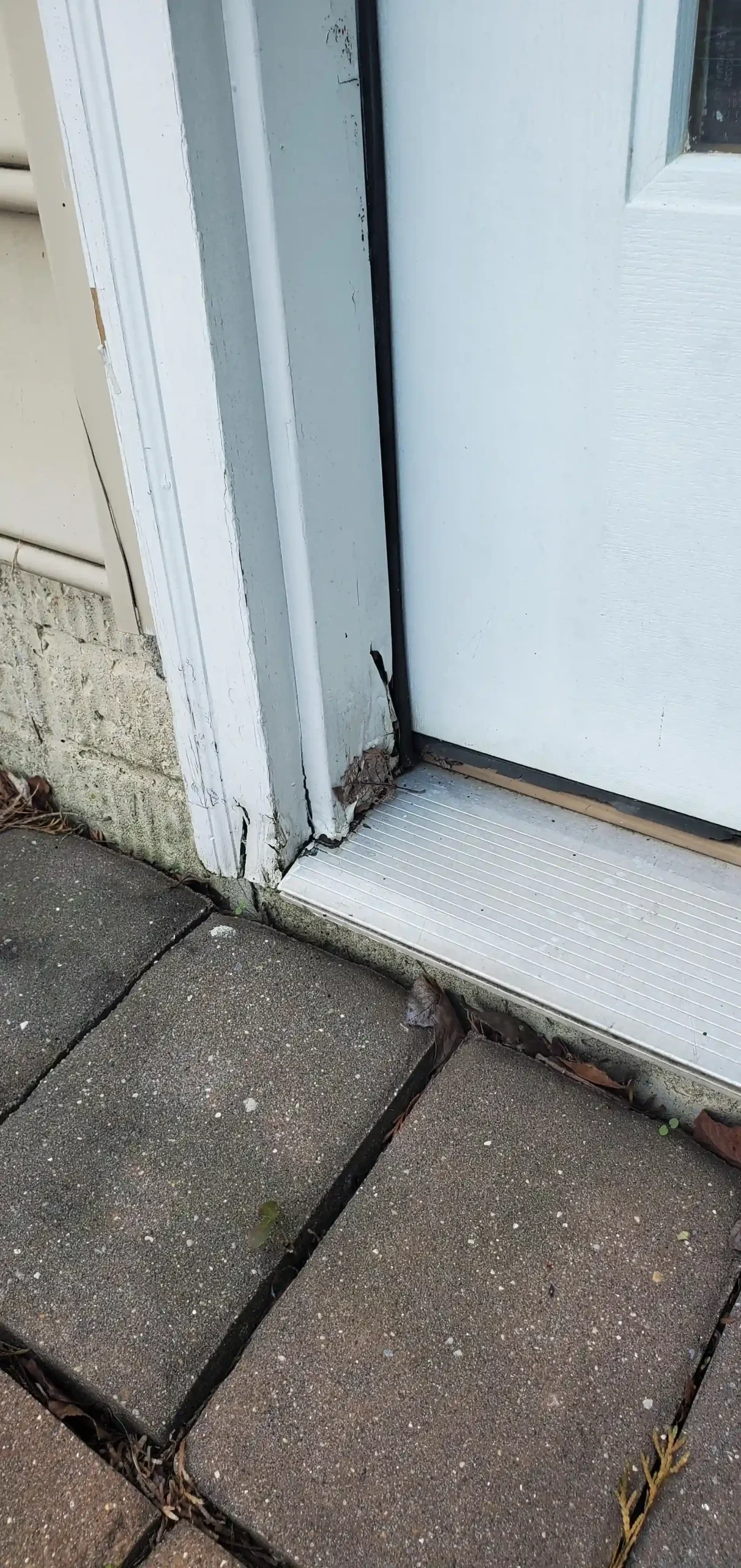 Exterior door with visible damage along the edge