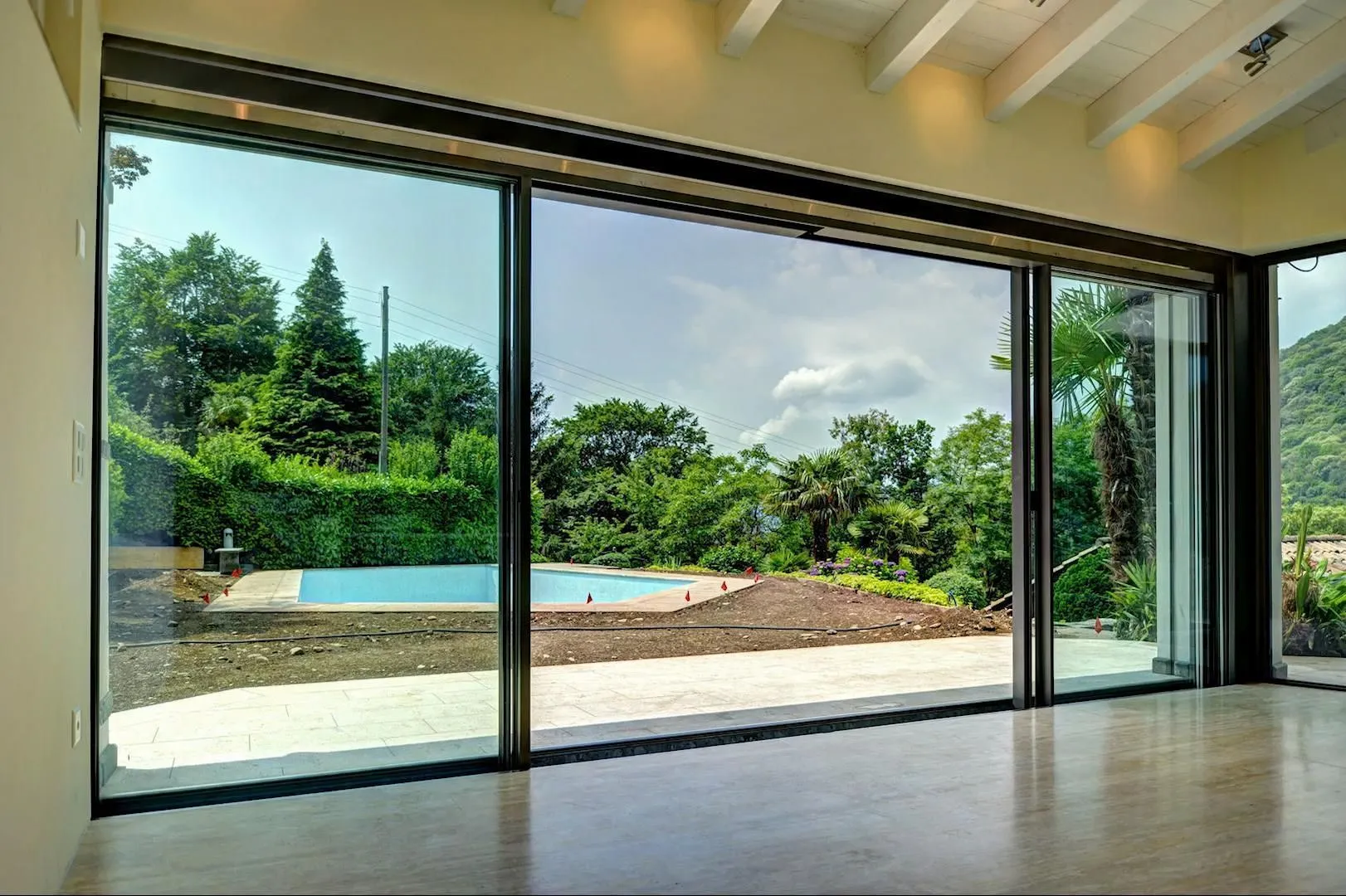 Modern fiberglass sliding door with a wide glass panel and sleek frame