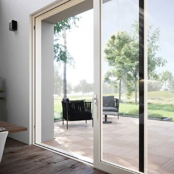 Sliding glass door with outdoor seating and green view