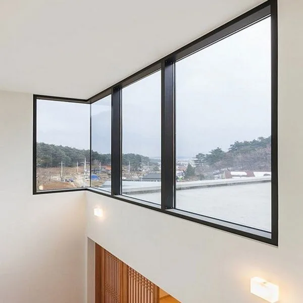 Large glass fixed windows with black frames and scenic view