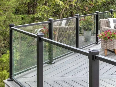 A modern deck featuring aluminum glass railings and stylish outdoor furniture perfect for relaxation and entertainment